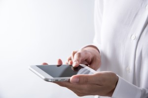human hand using smartphone on white background